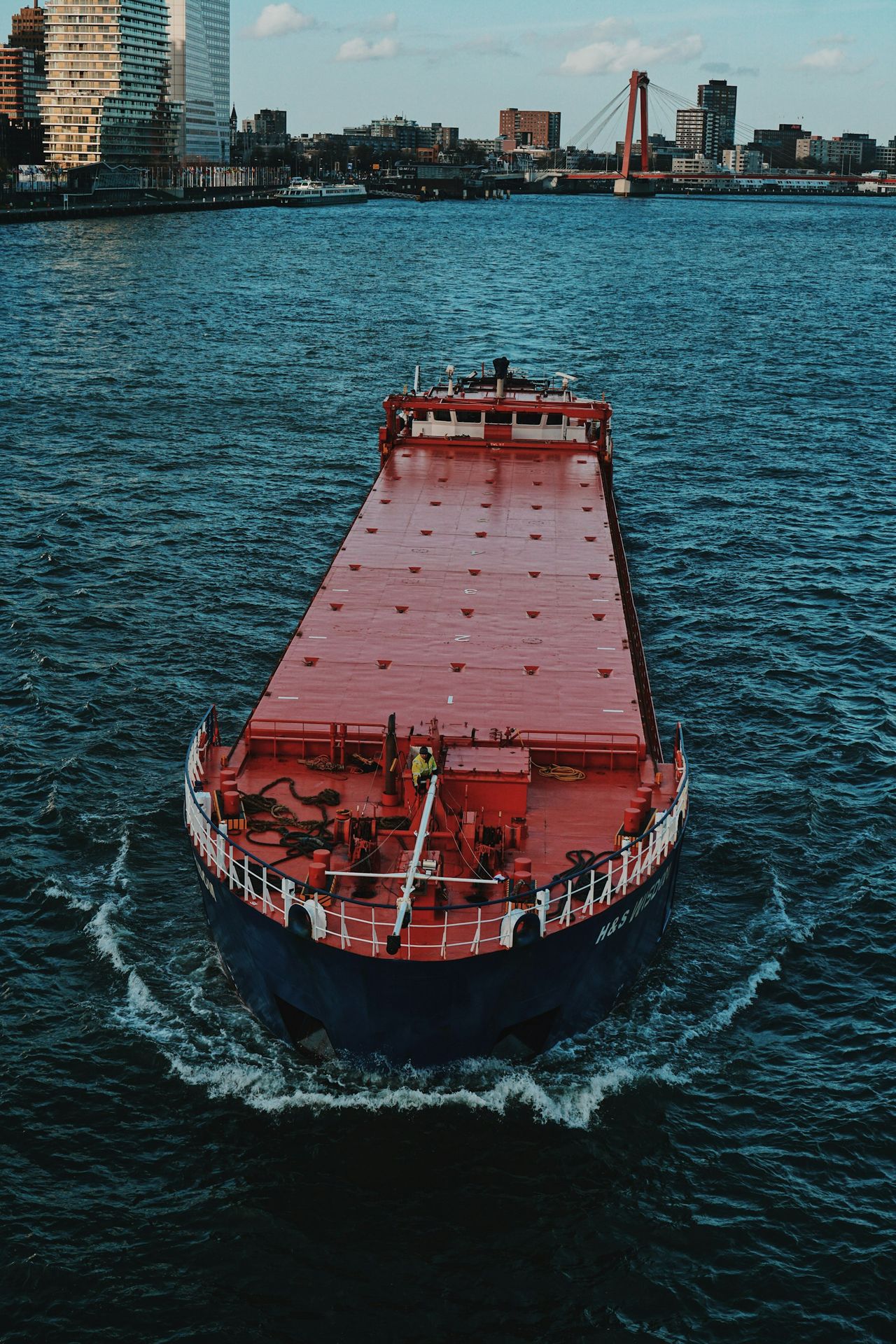 red and black ship on sea during daytime